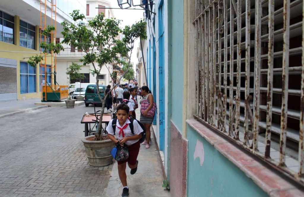 Kids running down the street in Old Havana