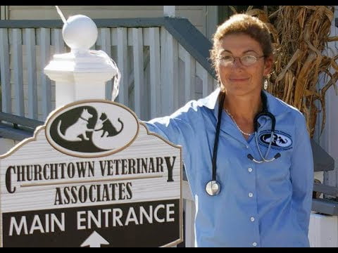 Dr. Judy in front of her vets office