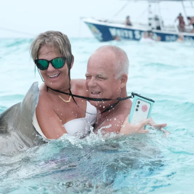 Attack of the friendly stingrays! #grandcaymen #swimmingwithstingrays #triciaryansnow #genxlife